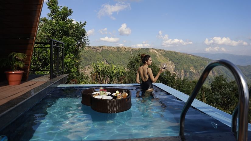 a guest in the pool - Polo Cherrapunjee Resort