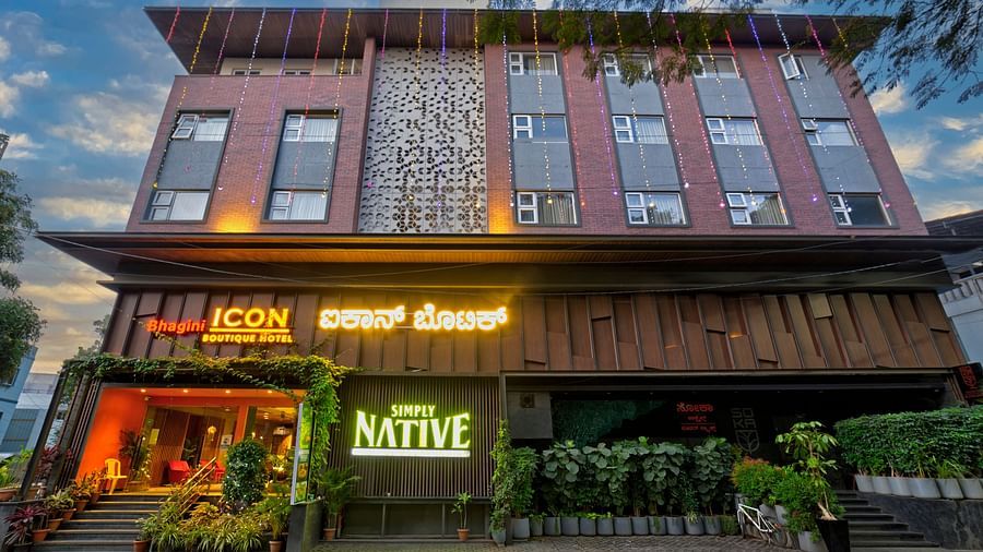 A modern and stylish hotel building with a rustic facade, featuring the name ICON Boutique Hotel by Bhagini and NATIVE in bold letters.