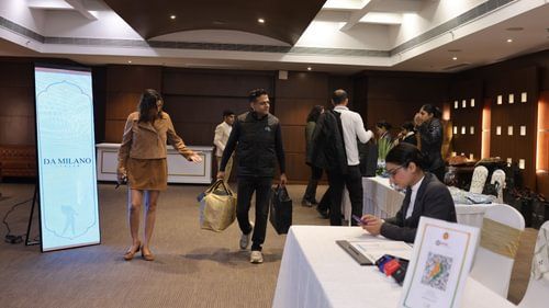 An image of a people carrying bag in a room which is filled with other packed items at Heritage Village Resorts & Spa