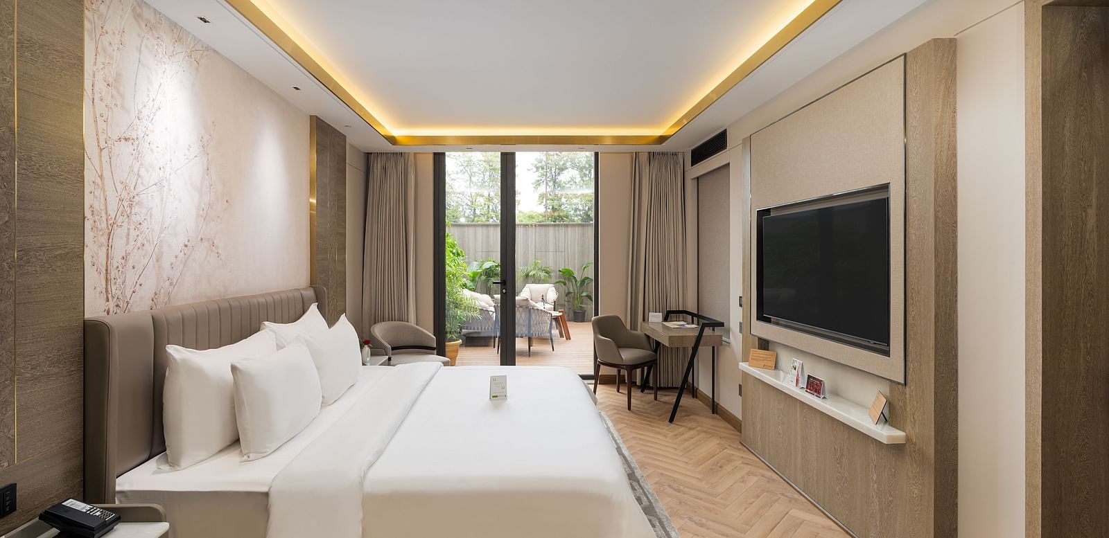 Nirvana Suite bedroom furnished with two queen size beds, tasteful decor, and ample natural light - Nirvana Luxury Hotel, Ludhiana