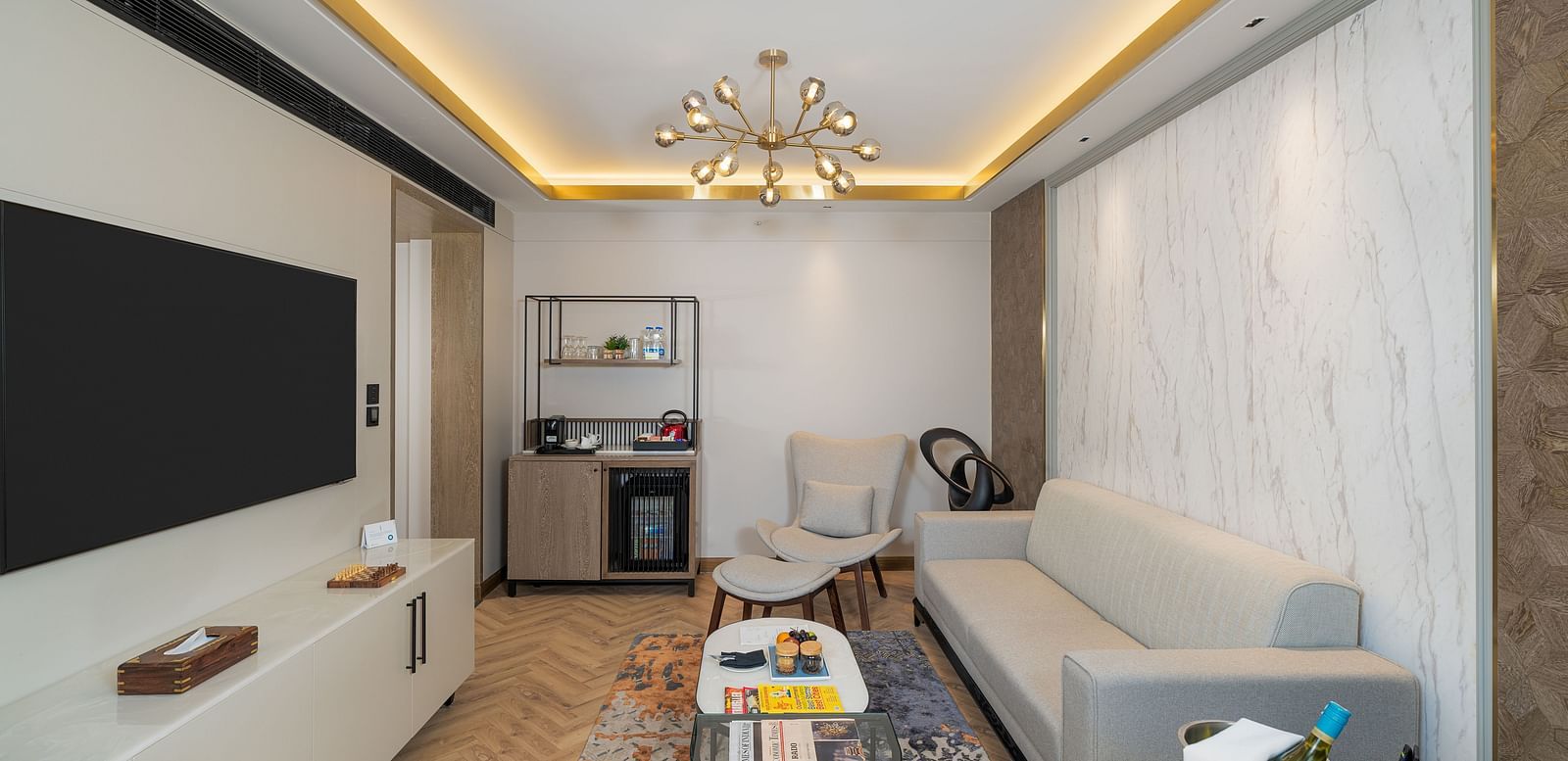 Nirvana Suite offering a dedicated workspace, a cosy seating area, and a convenient kitchenette  - Nirvana Luxury Hotel, Ludhiana