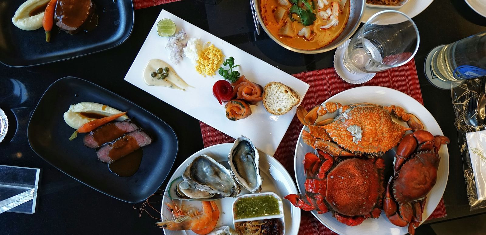 Various seafood dishes arranged on a table.