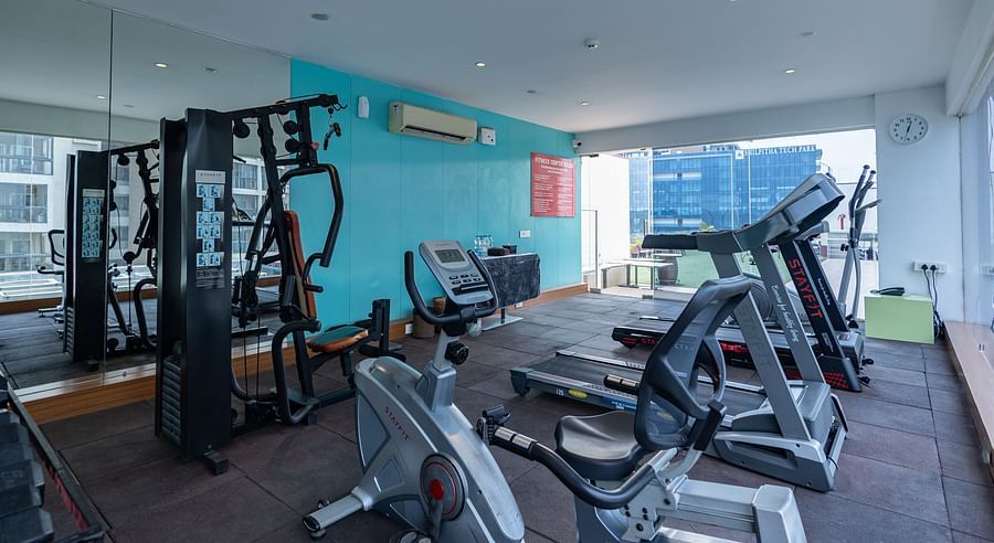 Gym area with treadmills and weights at Icon Premier Hotel by Bhagini, Devarabisanahalli