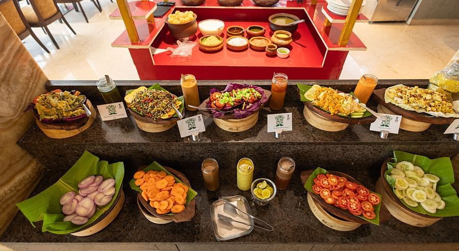 Salads arranged on the table at Icon Premier Hotel by Bhagini, Devarabisanahalli