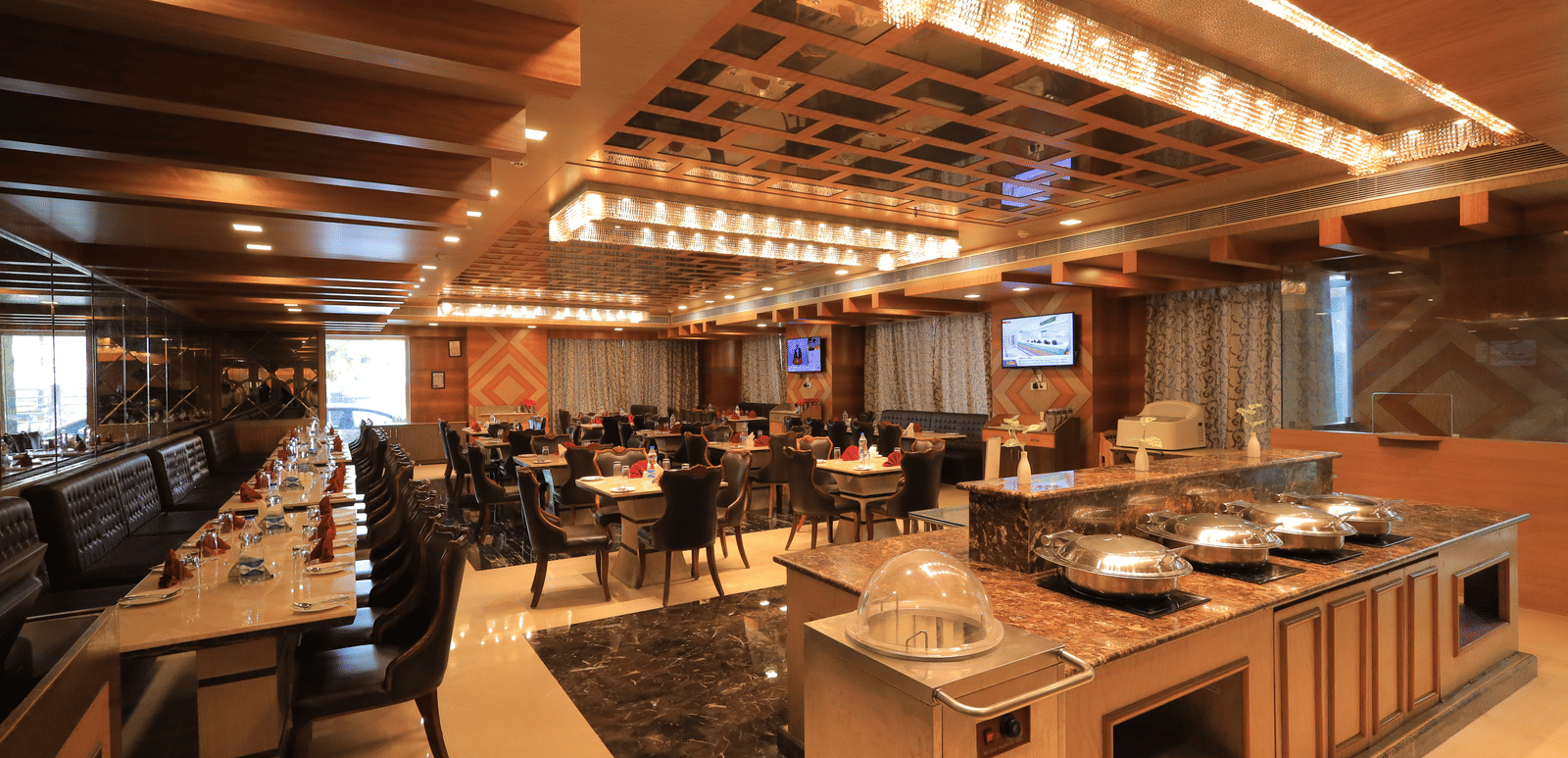 Corner-view shot of the Porchae restaurant featuring a buffet counter overlooking the elegant dining area.