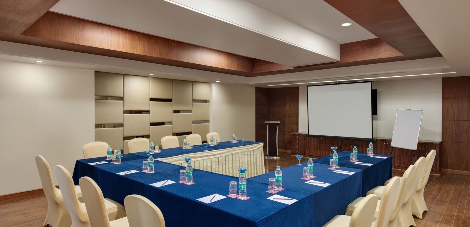 Board room with blue conference table and executive seating at Ramada by Wyndham Ghaziabad Vasundhara