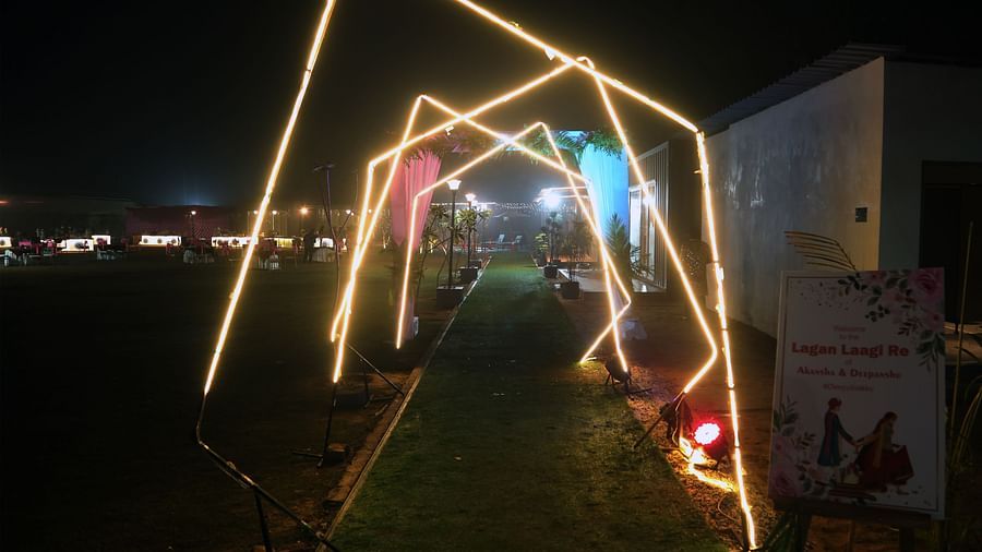 Illuminated archway entrance at night at Tisya Farms, Gurgaon.