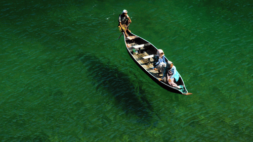 a boat on crystal clear water 39