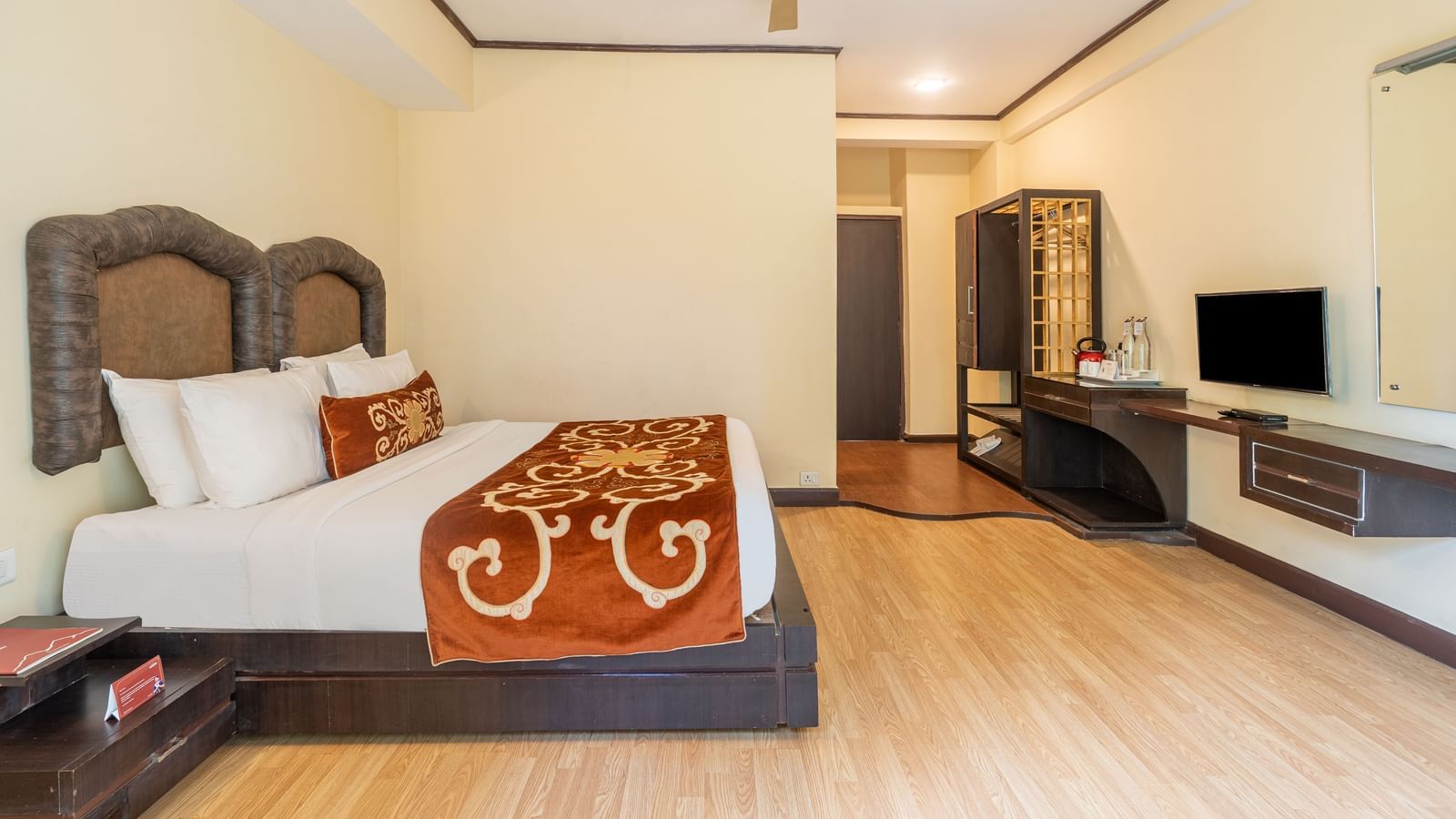 king size bed of deluxe bed at Summit Lillium Hotel & Spa, Kalimpong