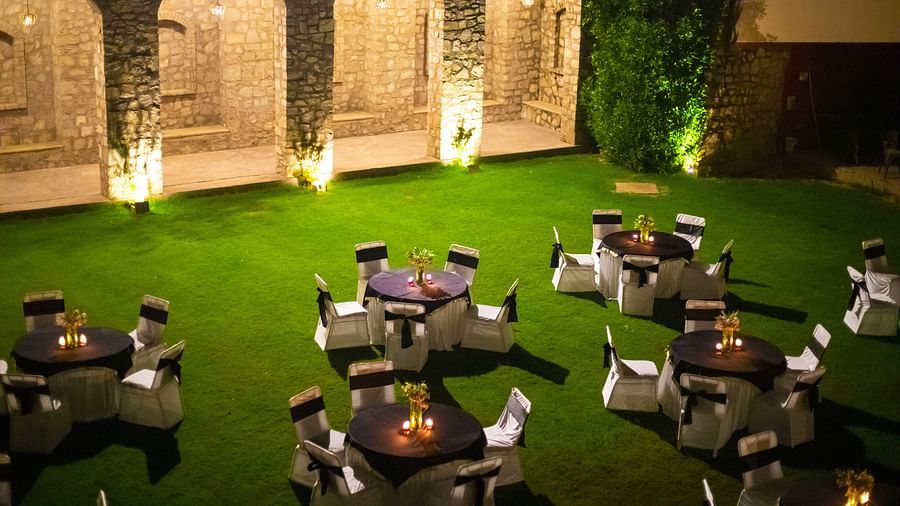 lush green Garden with banquet chairs 