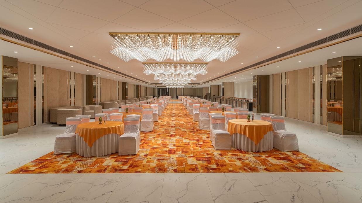 Grand banquet hall with elegant chandeliers.