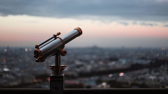 a telescope on the terrace facing the sky and captured during sunset
