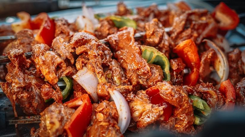 Meat dipped in saucy chutney and grilled with chopped vegetables