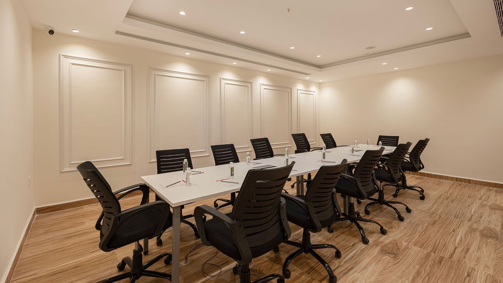 Professional meeting room with ample lighting and seating for corporate discussions at Lemonridge Hotels, IDPL Balanagar.