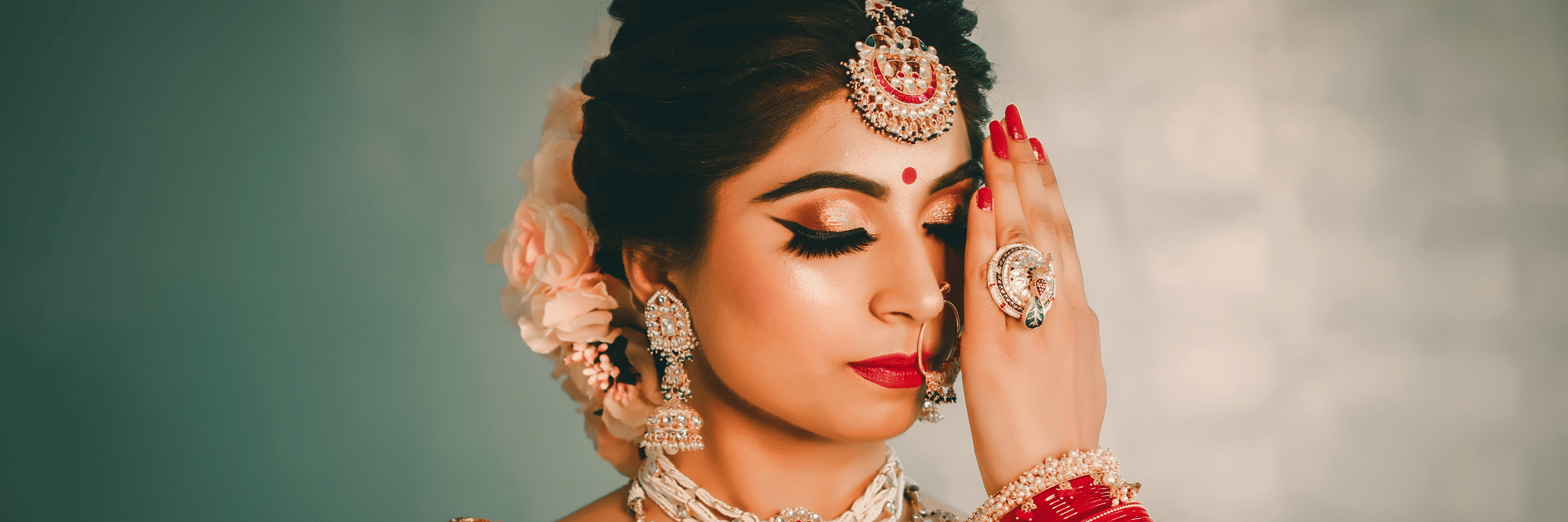 A woman dressed as a bride posing for the camera.