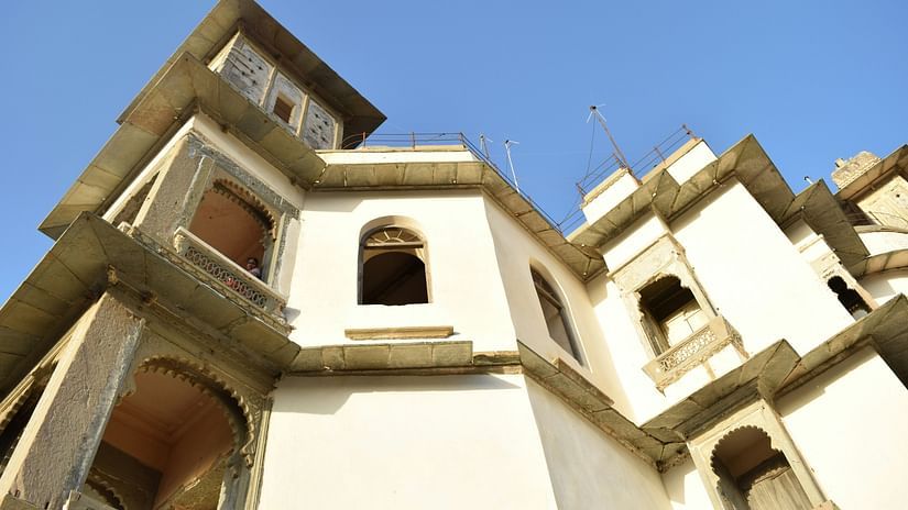 sajjangarh palace with a backdrop of clear blue sky