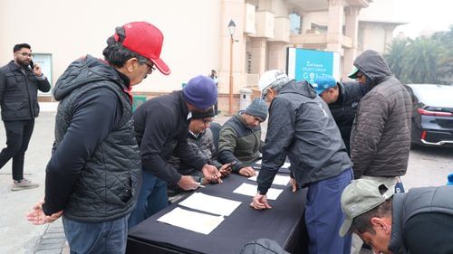 An image of a group of people registering themselves for annual select group for golf at Heritage Village Resorts & Spa