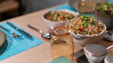 A variety of foods arranged on a dining table at BluSalzz Escapade Resort, Lansdowne