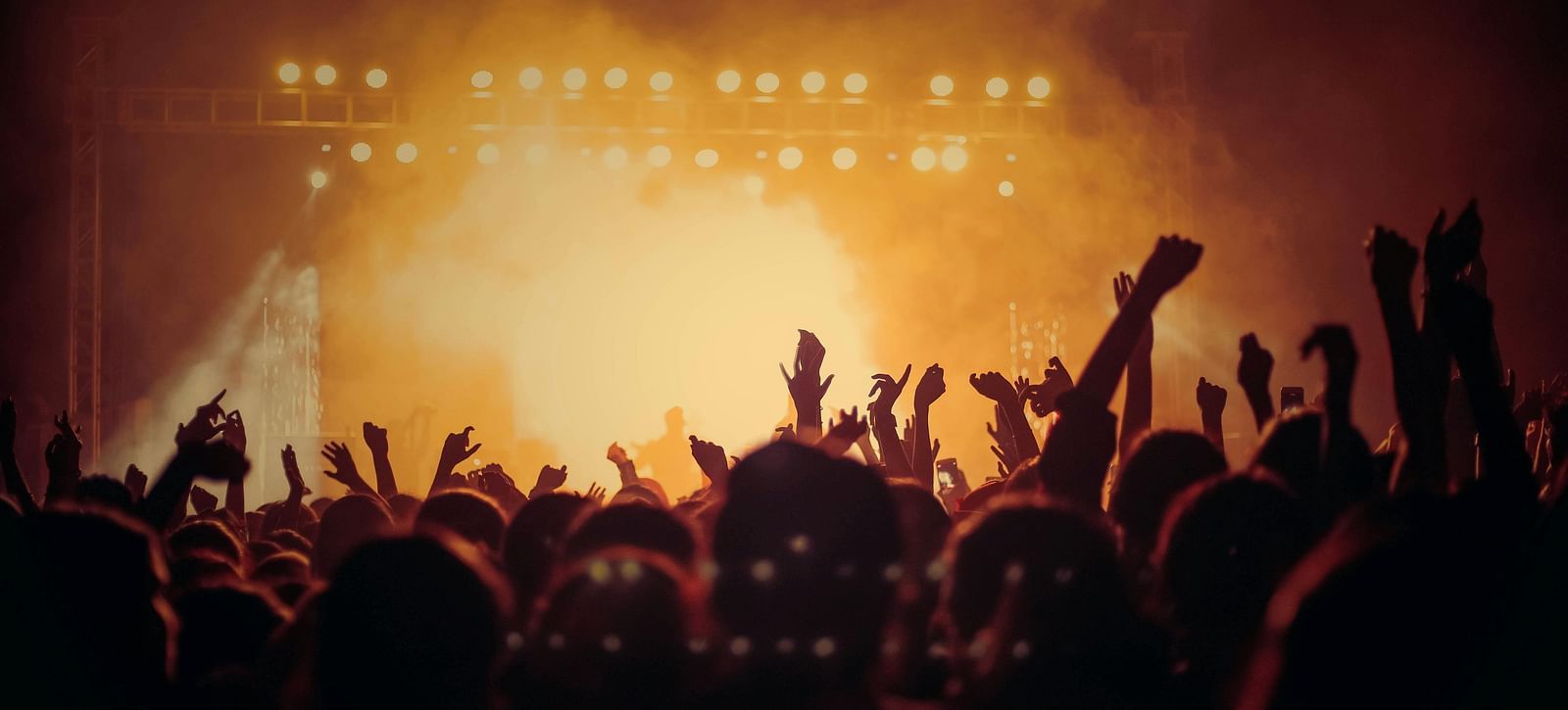 A crowd of people cheering in a concert |  Mango Hill Central, Chennai