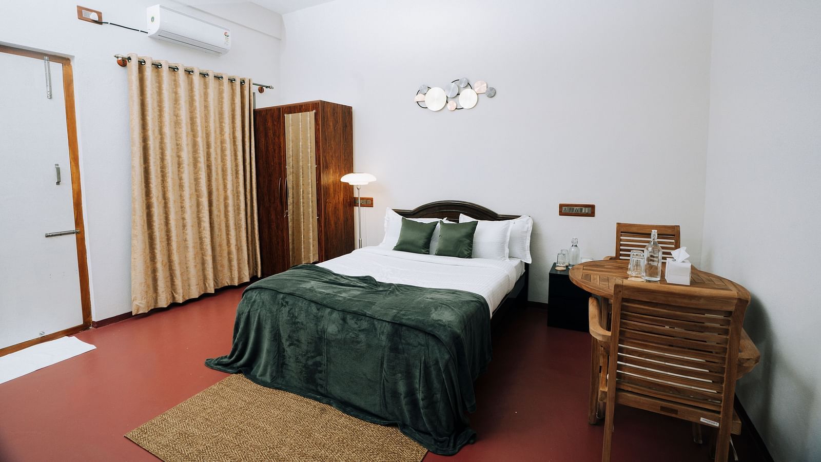 A bed, wardrobe, and work desk in a  room | Habba Dates Villa, Hampasandra