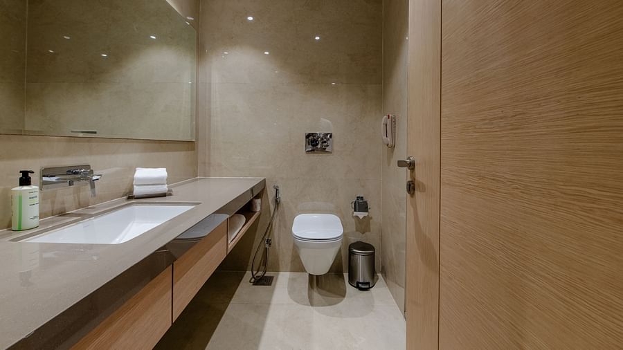 A modern bathroom with sleek finishes and well-lit surroundings - Sarovar Portico, Ajmer
