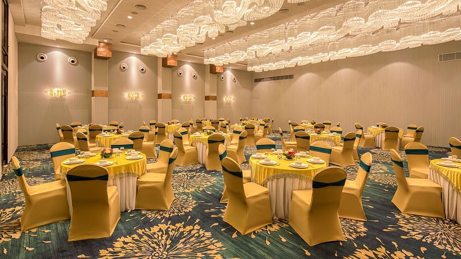 Yellow coloured chairs in the Sumo Anaika Banquet Hall at Le Foliage by TGI, Bangalore