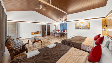 Spacious accommodation in Quad Room With Pool View at Hatti Eden Coorg, with vaulted ceiling.