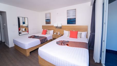 An image of a Montego Bay hotel room with double beds and a balcony - Hotel 39, Jamaica (Montego Bay)