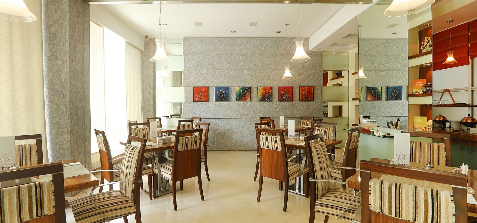 Dining setting of a restaurant at Regency Hotel, Mumbai.
