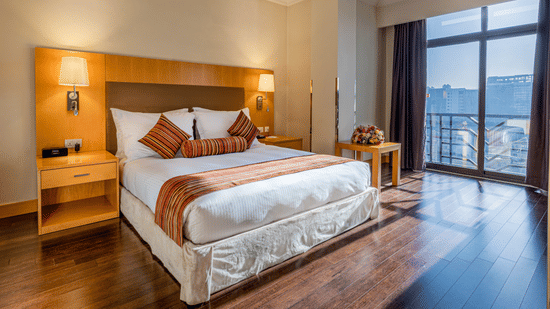 A well-lit Executive Suite featuring a king-size bed, side tables and lamps at Ramada by Wyndham Addis, Addis Ababa, ready to be booked with our Ramada offers