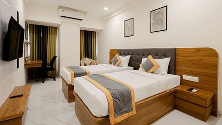 Stylish cosy twin room with twin beds and warm lighting at Lemonridge Hotels, IDPL Balanagar