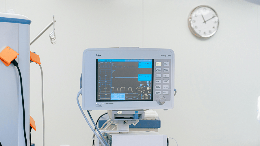 Patient monitoring equipment installed in a modern hospital intensive care unit.