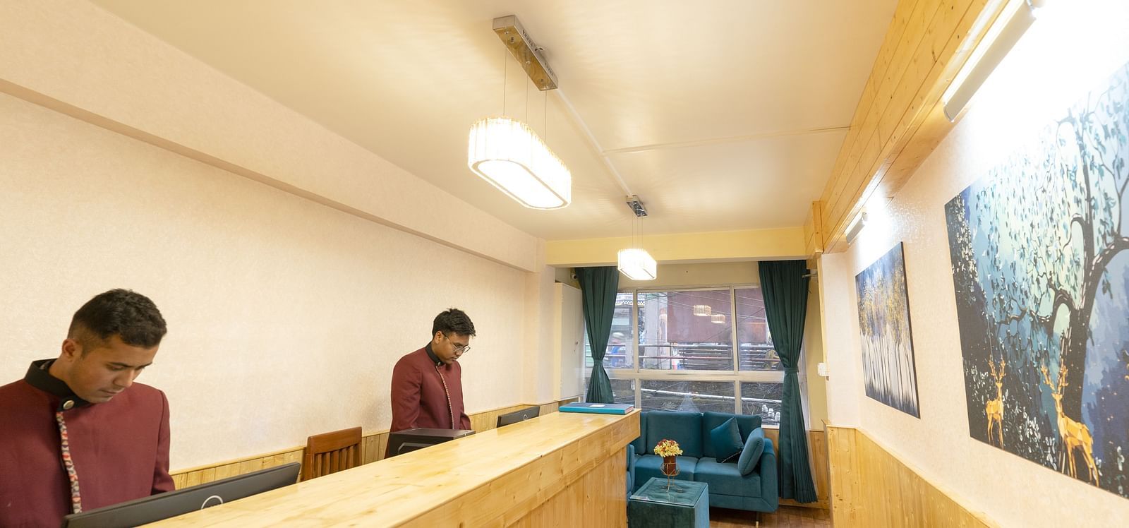 Reception with wooden desk and long hall way at Avianna Seven Seas, Darjeeling