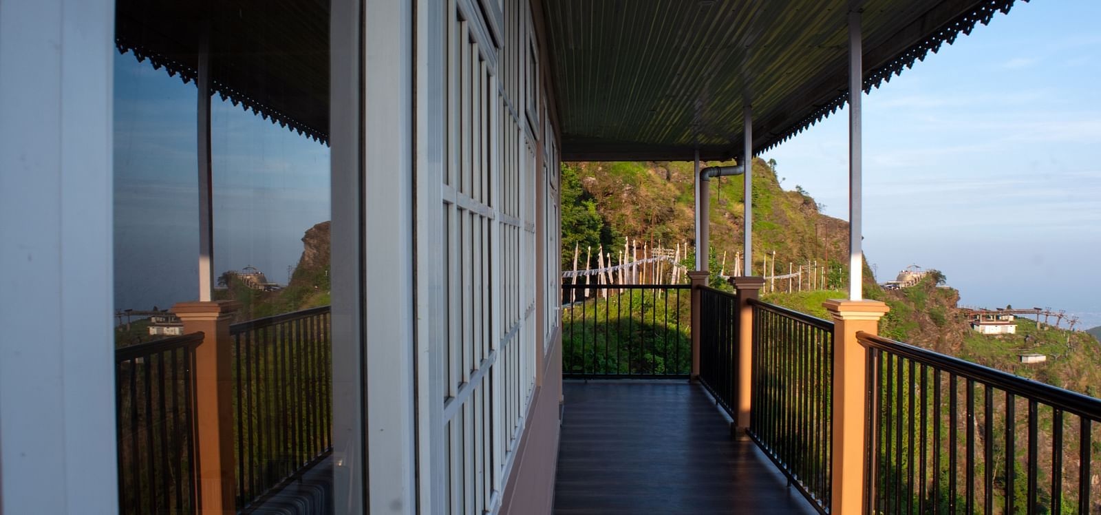 An image of a balcony with a backdrop of the Himalayas - Avianna Windy House Wellness Retreat & Spa