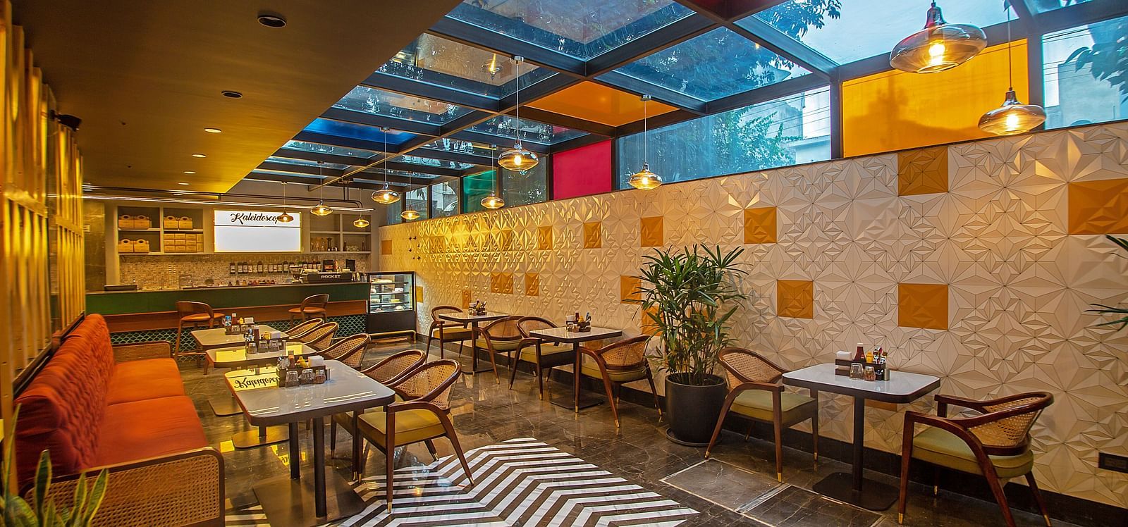 An image of a dining area with various seating arrangements including chairs, table, and sofa 
