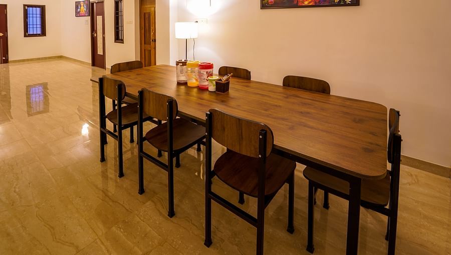 alt-text Dining area with a table for 8 set up inside Superior Villa - La Tamara Luxury, Pondicherry
