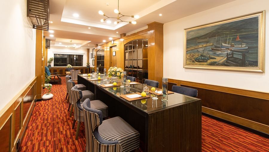 Classic boardroom with ornate carpet and artwork