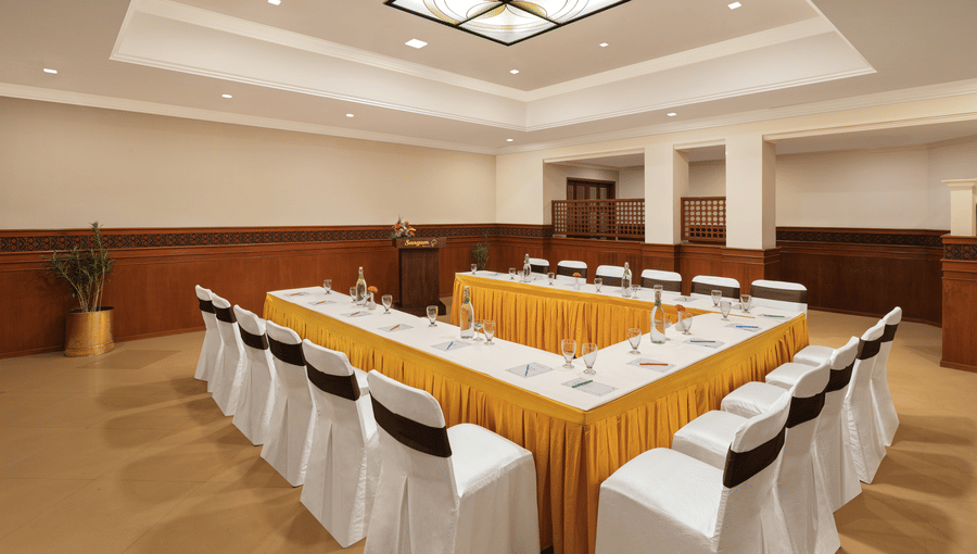 alt-text Seating arrangement in Shruti Hall at Sangam Hotel, Thanjavur
