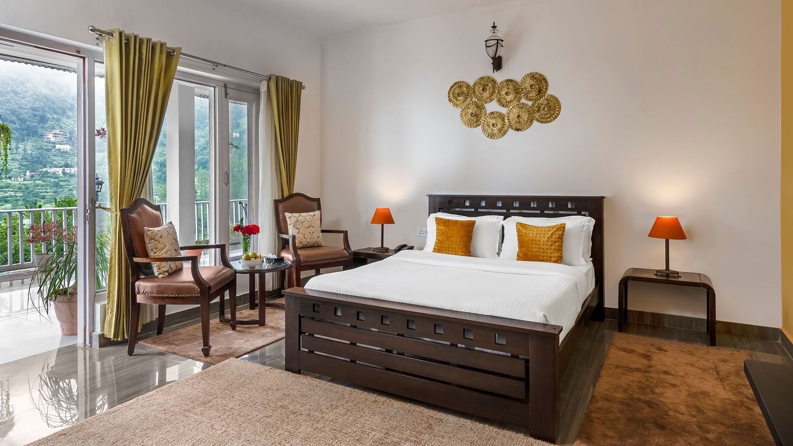 Spacious bedroom with large bed, seating area, and balcony access, at BluSalzz Collection - Suvaasa Resort, Ramgarh.