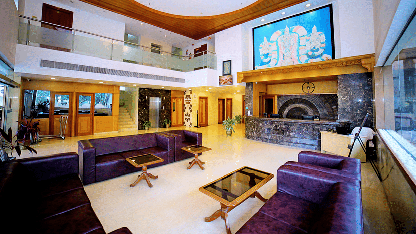 Image of the spacious lobby with seating and wall mounted artwork at the hotel.