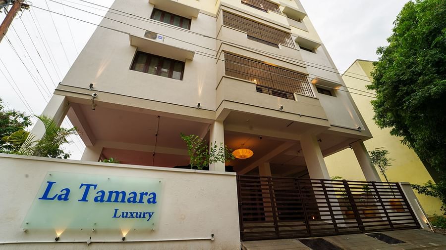 Facade view of La Tamara Luxury, Pondicherry with a tree next to it