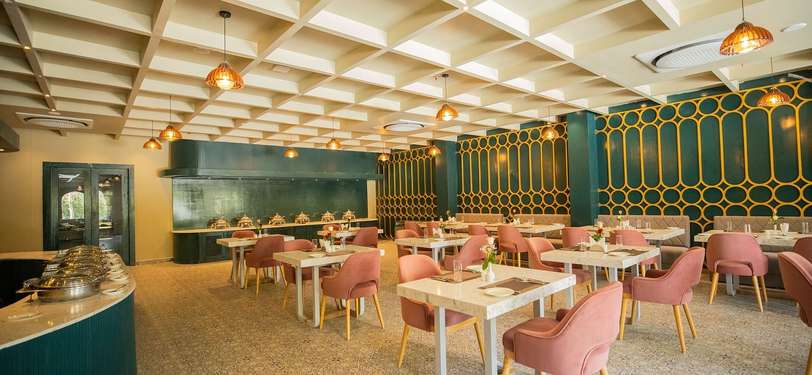 Image of a dining soace with seating arrnagement and a buffet table on the side.
