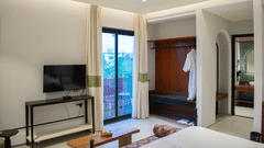 A bedroom view with a TV and a wardrobe unit at The Sierra