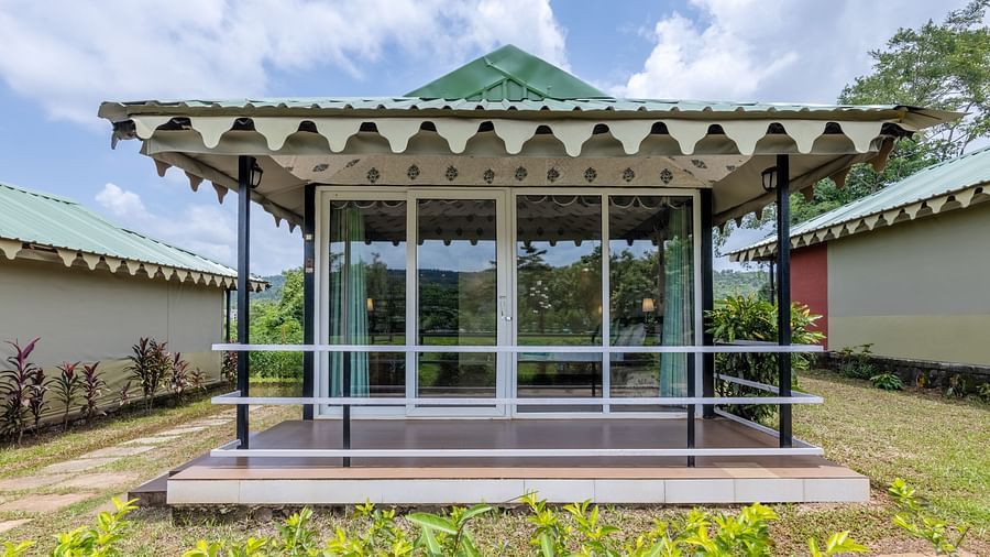 An image of well fabricated tent with glass walls and a small courtyard attached to it 