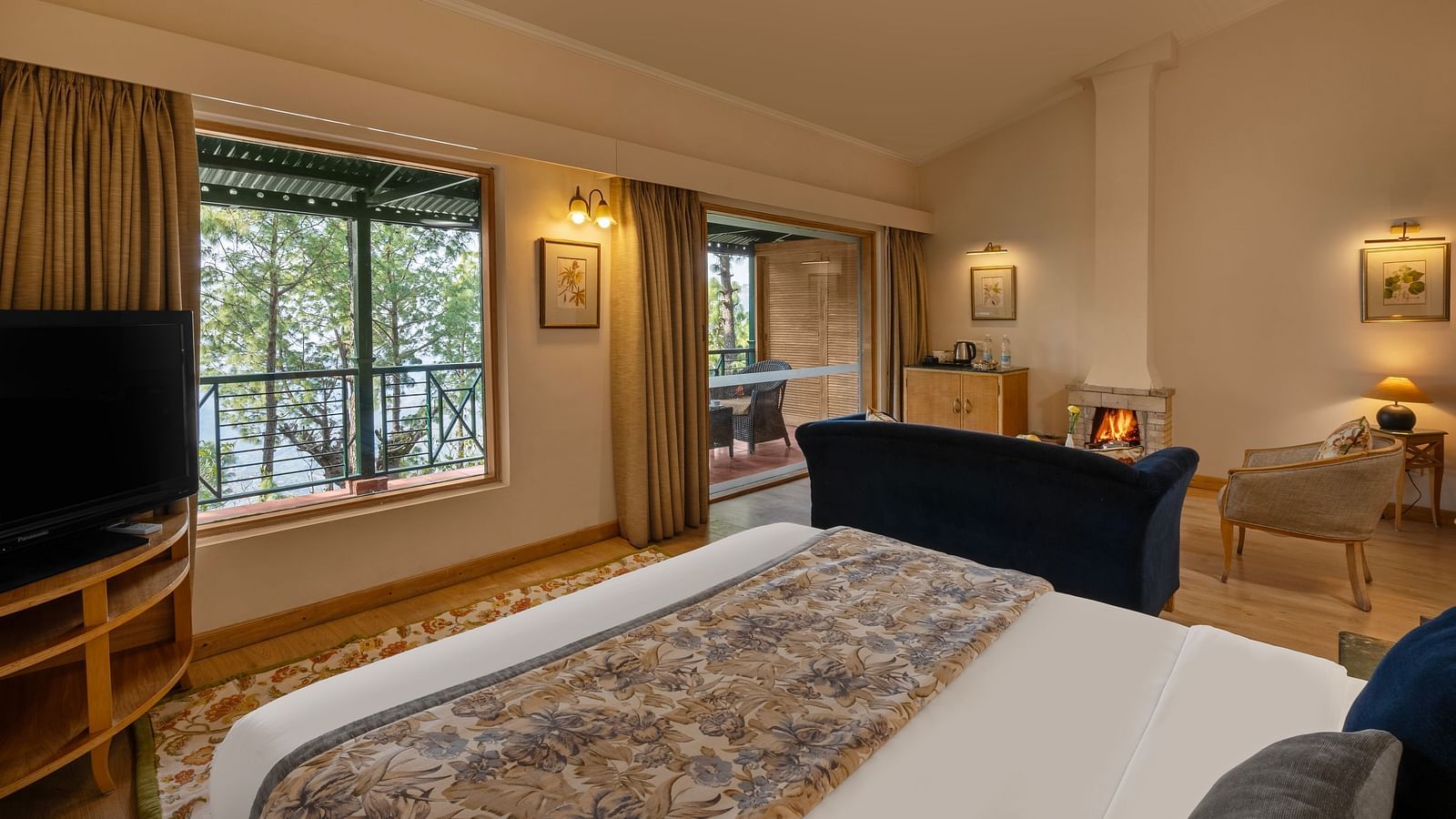 A premium cottage room featuring a cosy bed, open windows, and wall light fixtures that create a warm ambience -  Baikunth resort, kasauli 