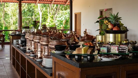 Different containers on a table for buffet at Navarasa restaurant TGI Tapovana