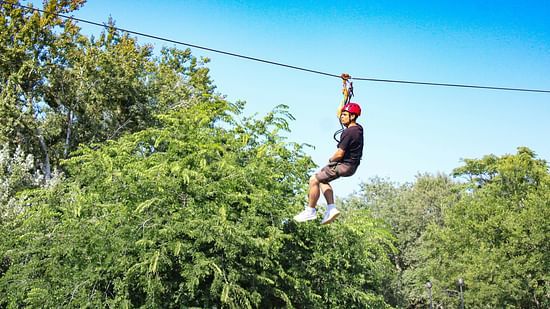 A person enjoying the zip line activity