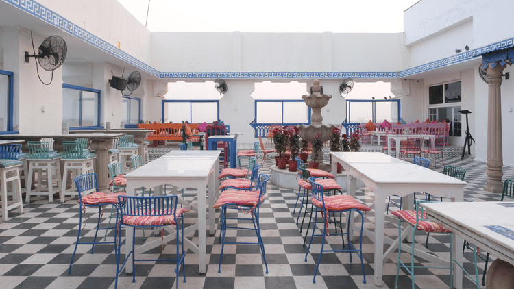 The elegant seating area of ta BLU Rooftop Bar at Clarks Amer, Jaipur