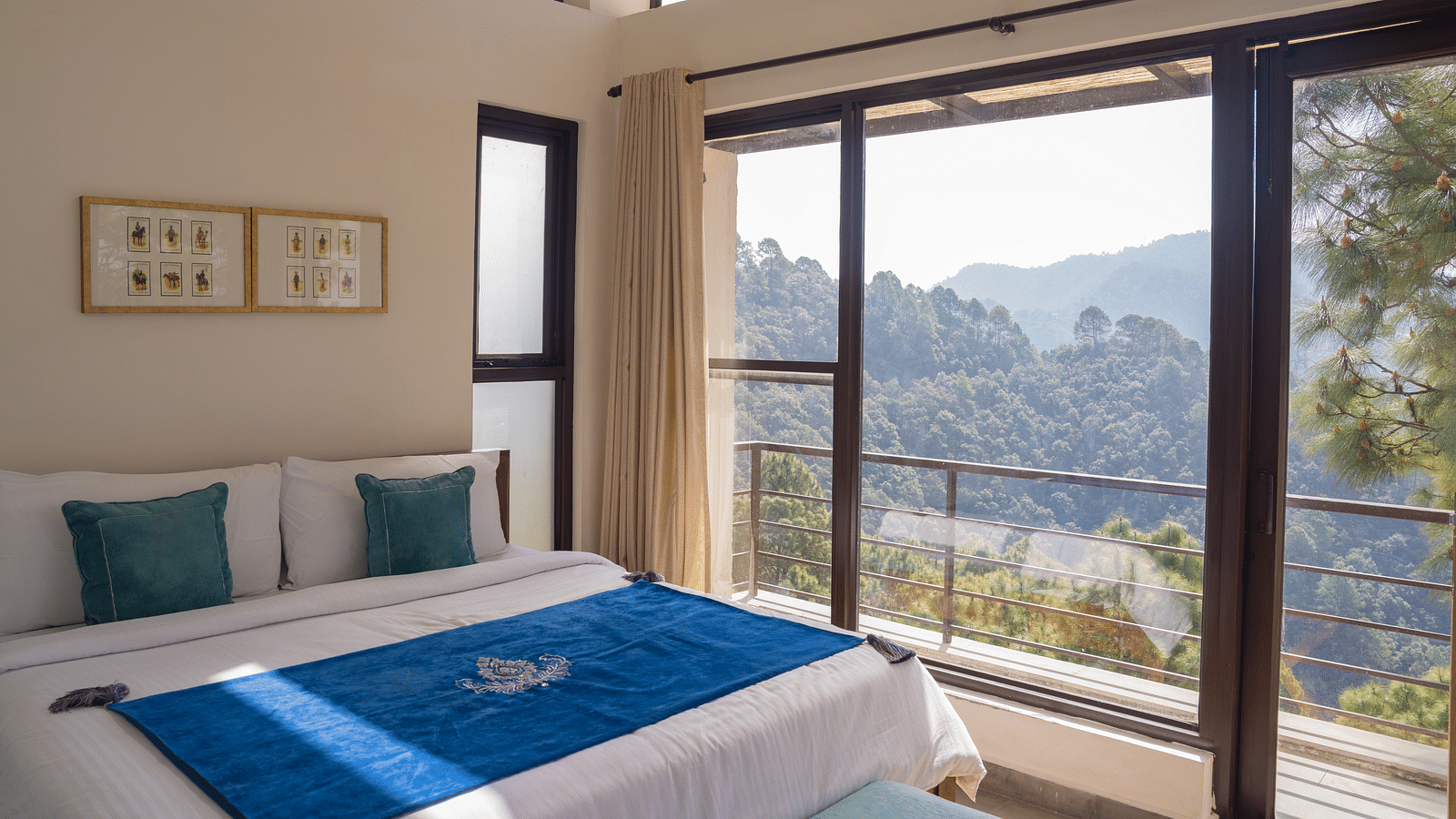 A  bedroom with pillows and a balcony at BluSalzz Escapade Resort, Lansdowne