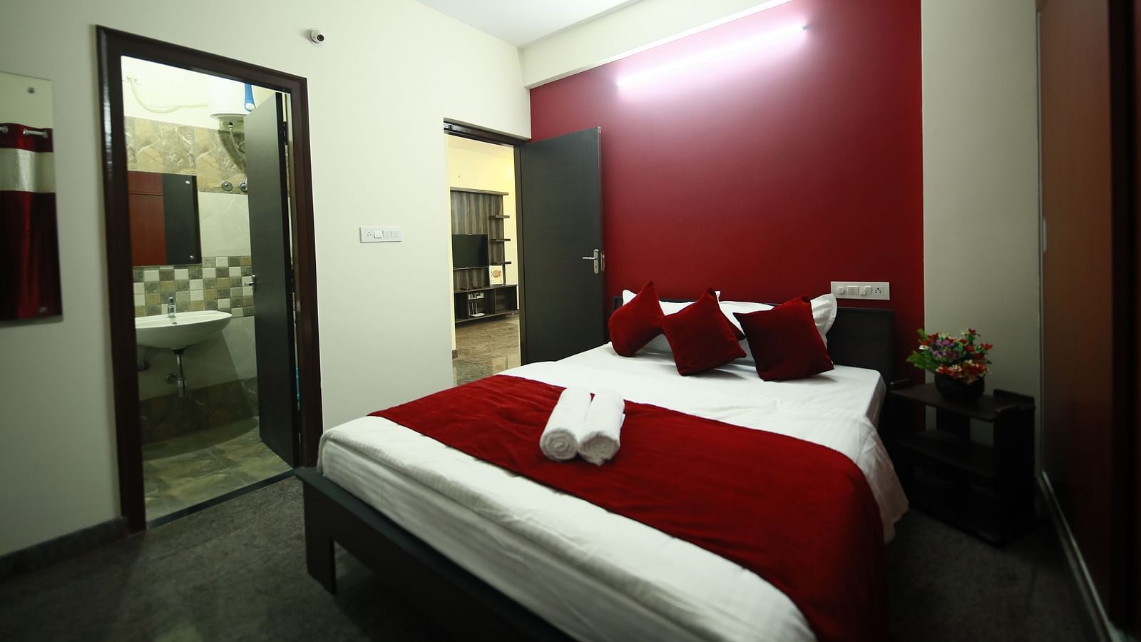 A queen size bed in a room at Tranquil ABS Orchid Serviced Apartments